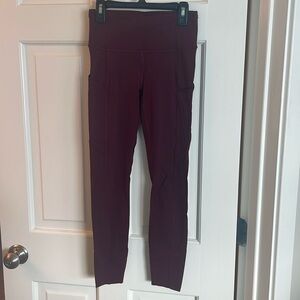 Women’s maroon size 4 Lululemon Fast and Free tight.